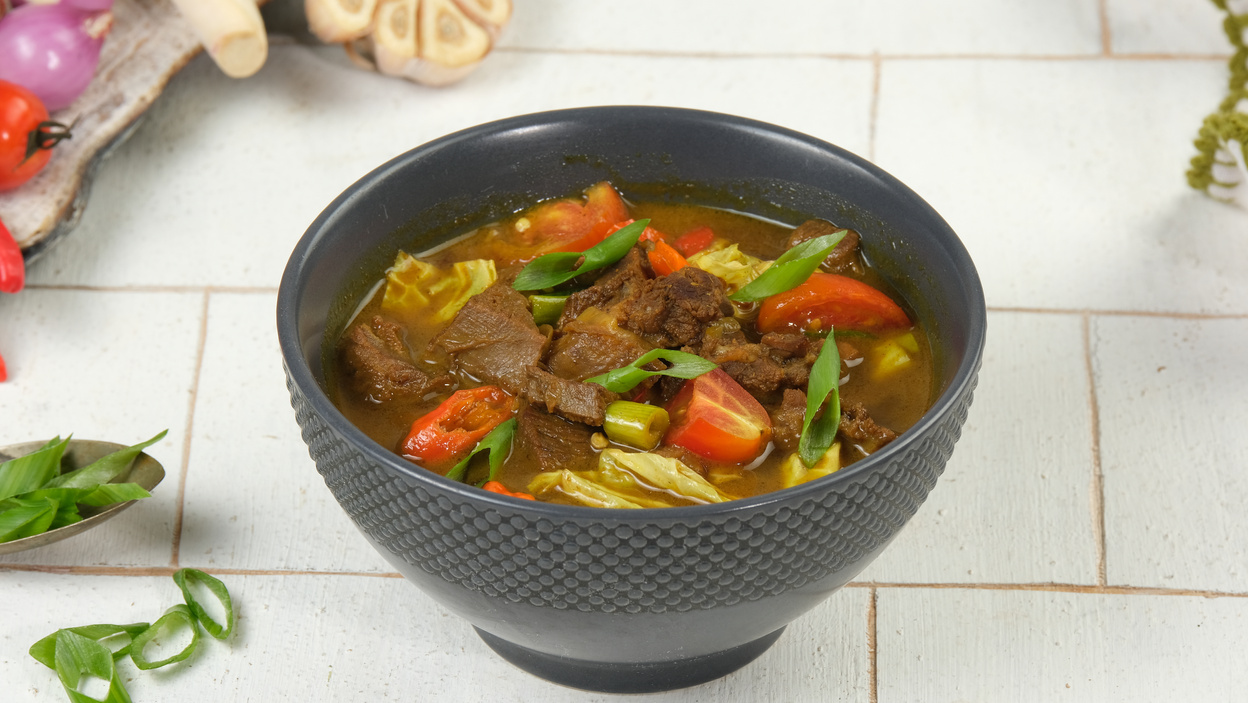 Tongseng kambing  is an Indonesian goat meat, mutton or beef stew dish in curry-like soup, with vegetables and sweet soy sauce.