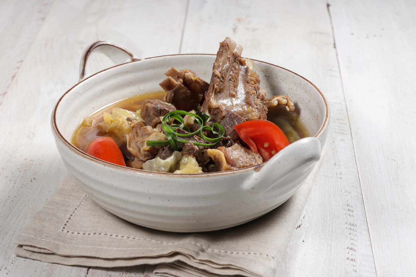 Tongseng Kambing is an Indonesian goat meat or mutton stew dish in curry-like soup with sweet soy sauce.