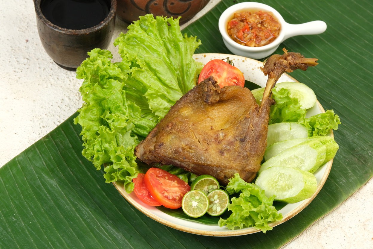 Bebek Goreng or Deep Fried Duck Served With Vegetables and Sambal (nasi bebek )-Indonesian Food Style.