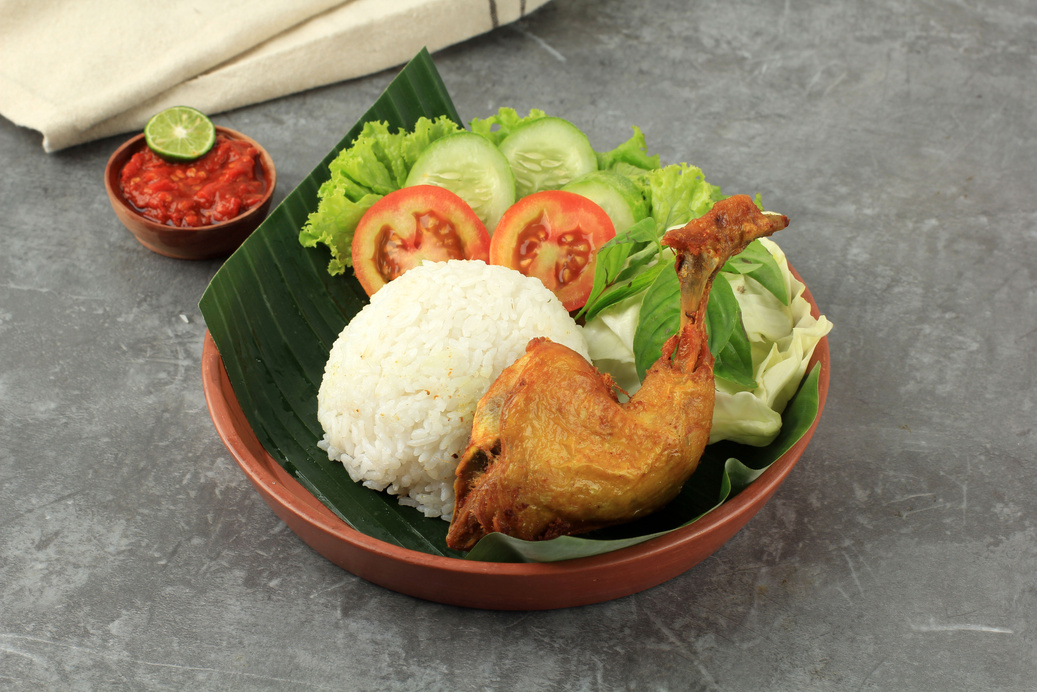 Indonesian Style Fried Chicken Served with Steamed Rice and Spic